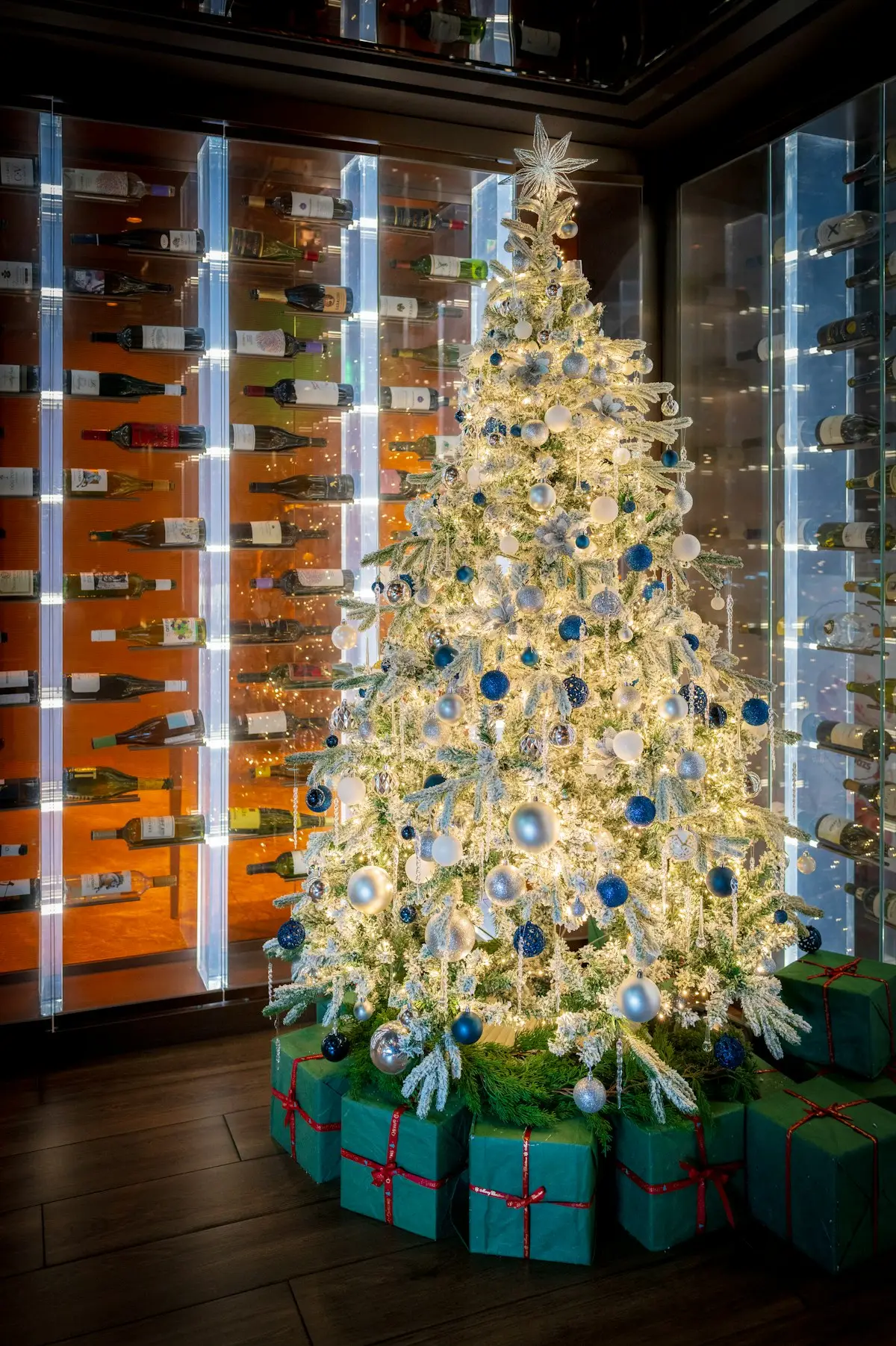 Decorated white Christmas tree with wrapped gifts