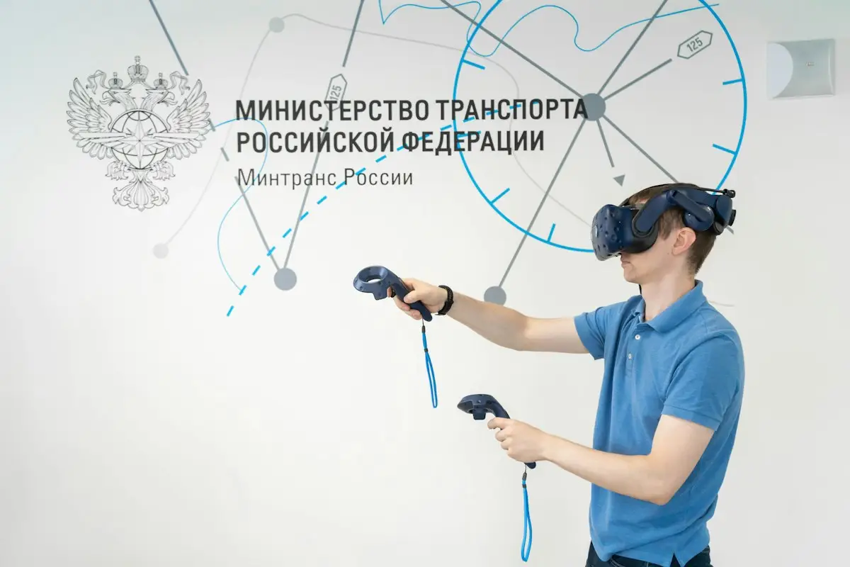 Man in a blue shirt wearing virtual reality glasses
