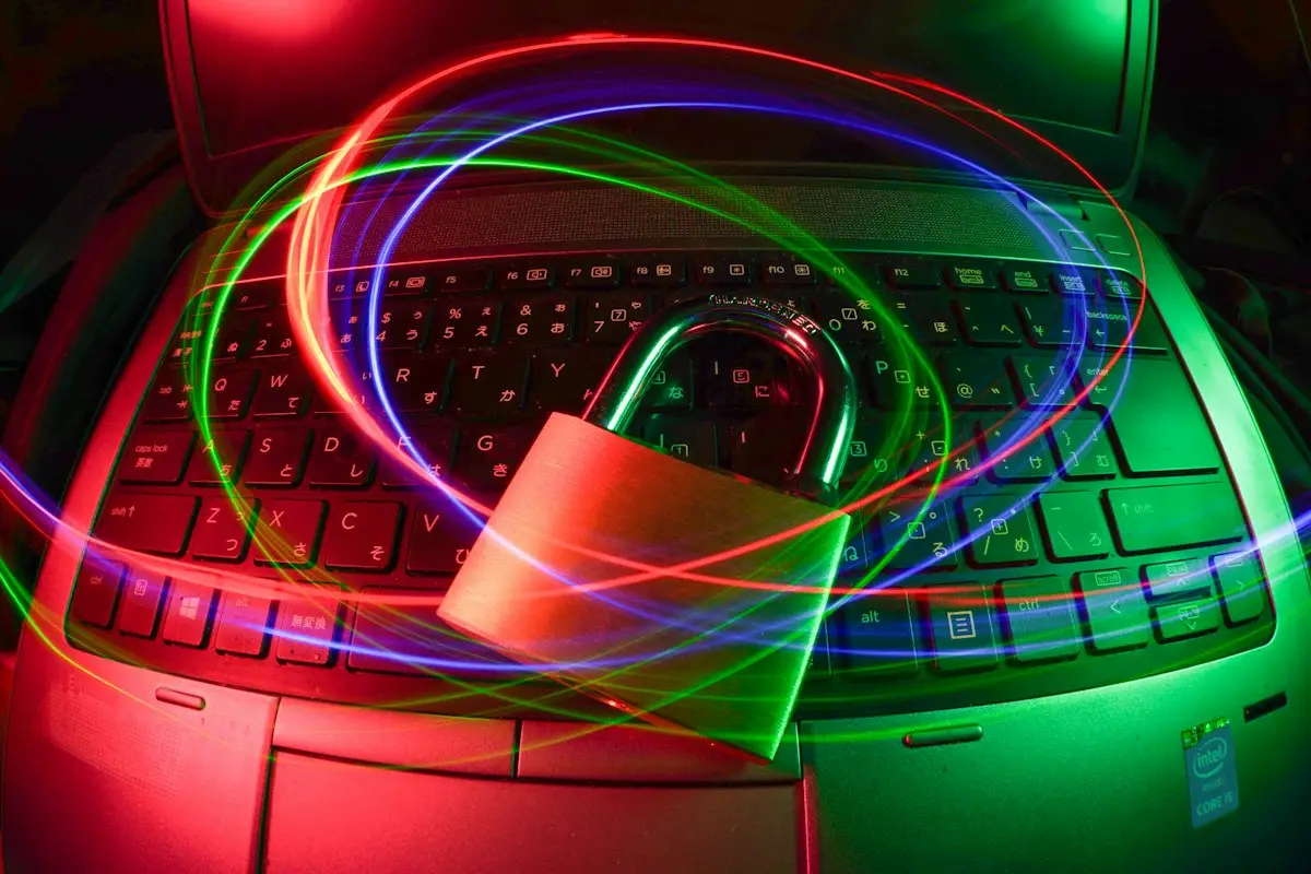 Padlock on a laptop with light trails