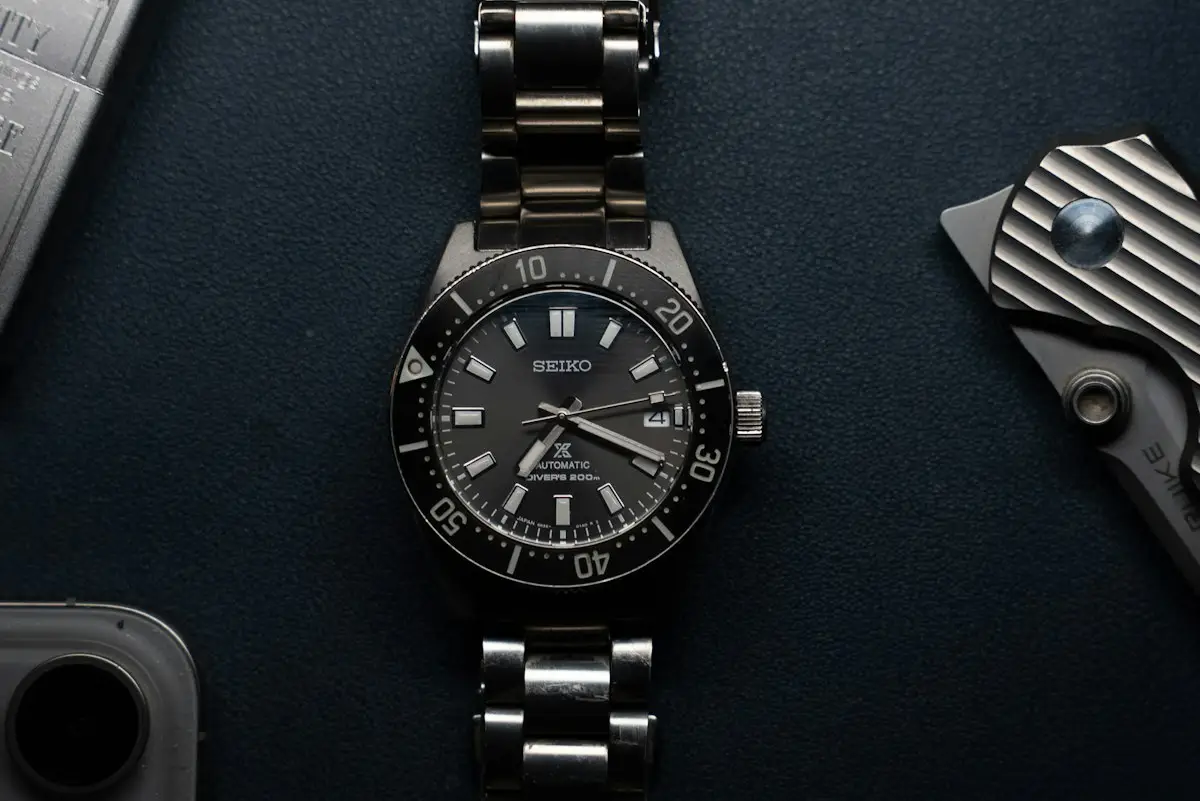 Close-up of a wristwatch with a dark dial