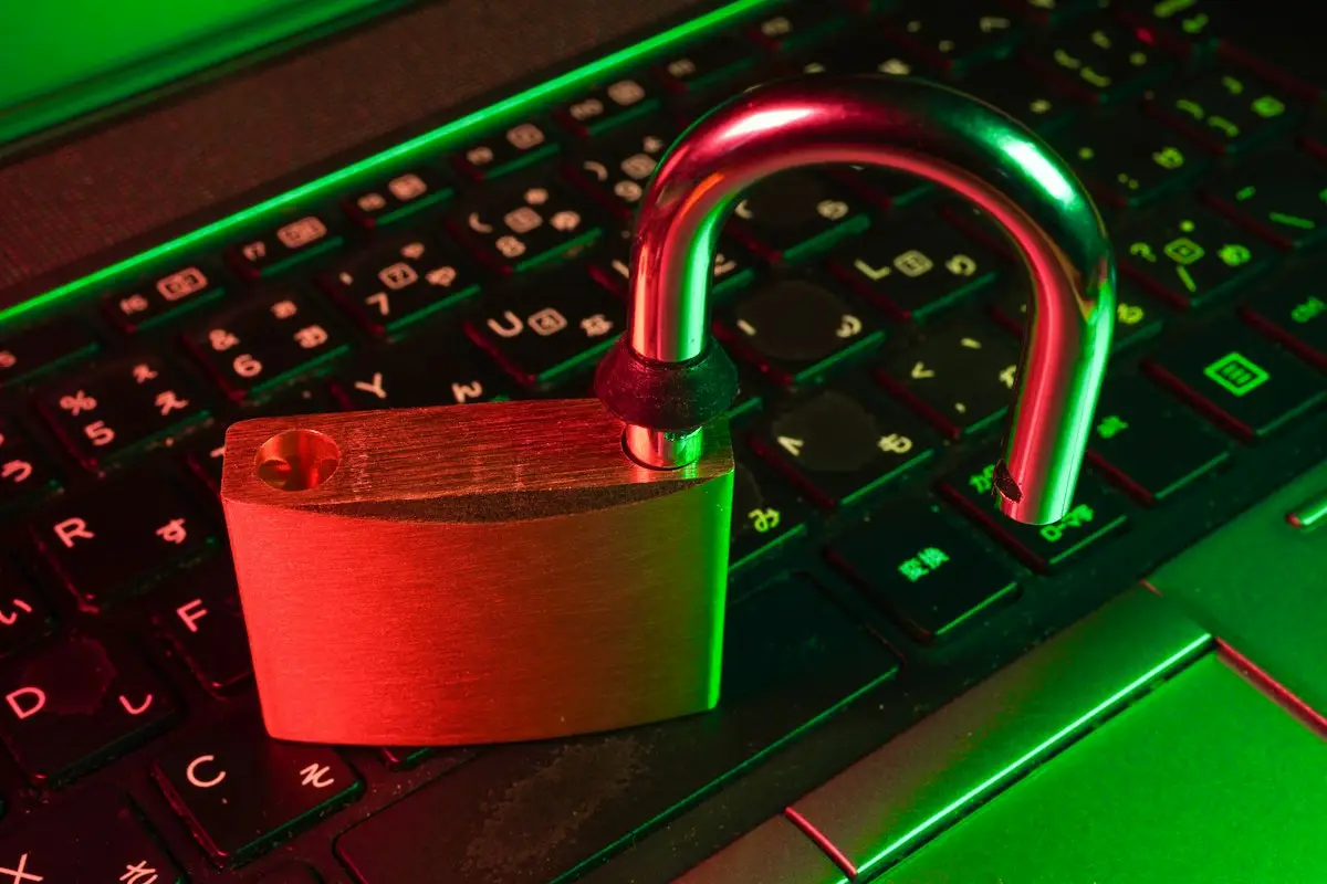Red padlock on a black keyboard