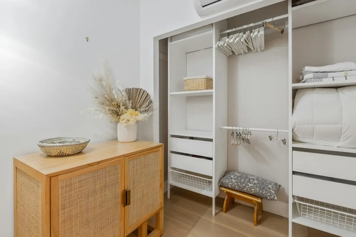 Wooden bed frame with a white mattress